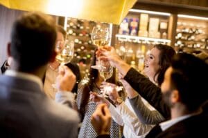 Young people toasting with white wine